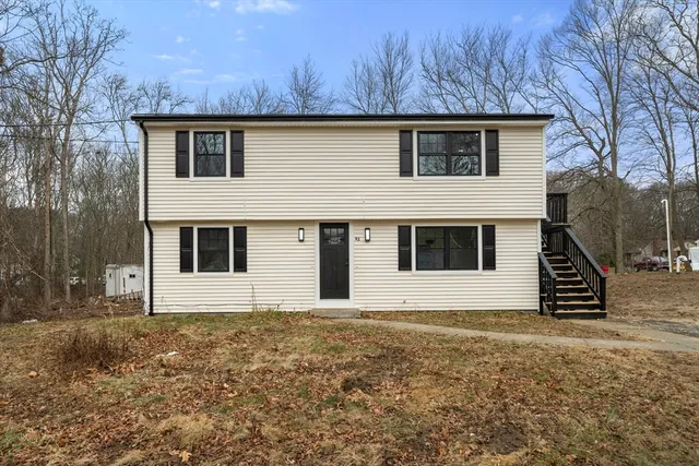 a house with trees in the background