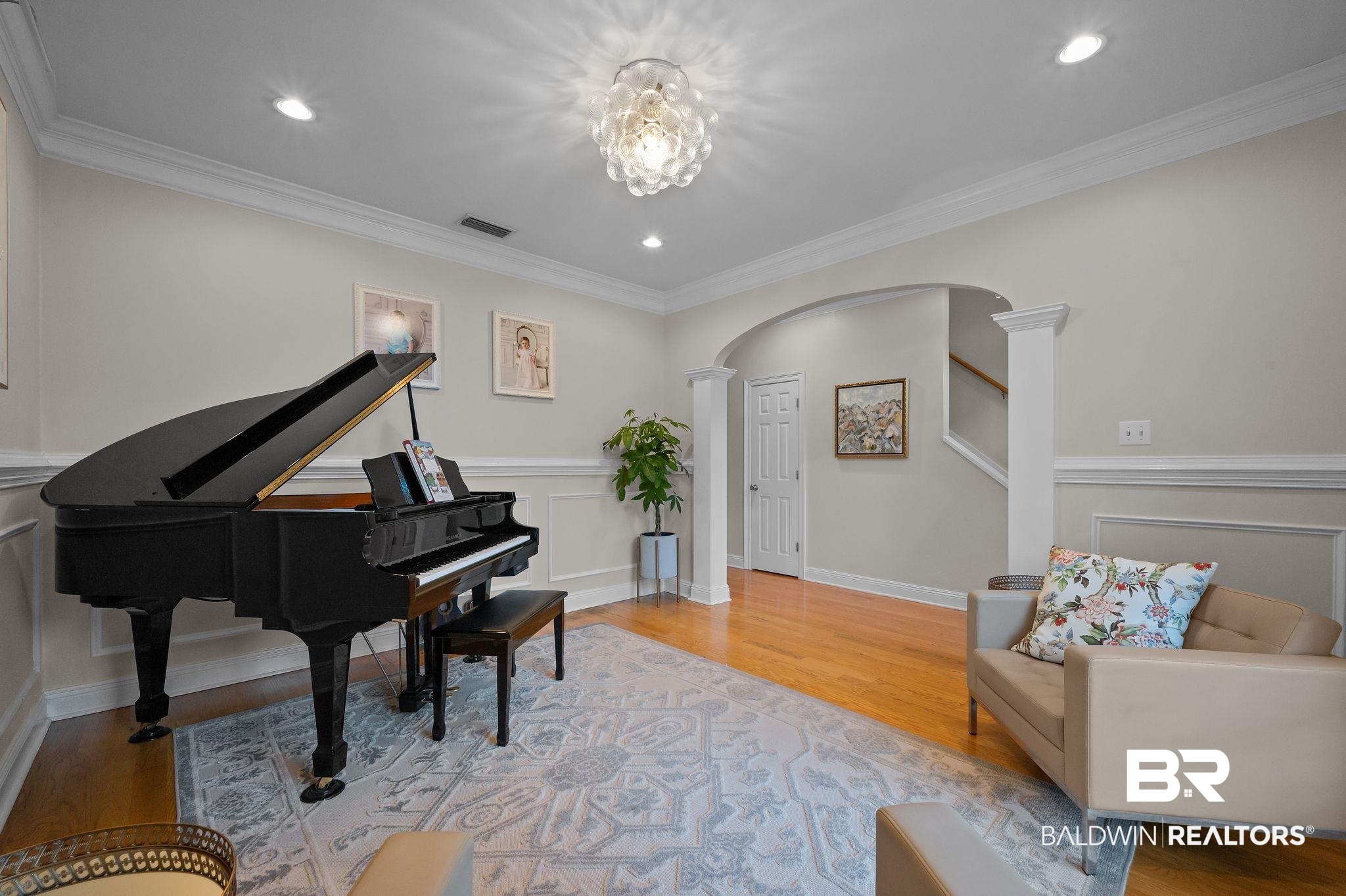 1825 Spring Hill Avenue Mobile, AL 36607 - Photo 11 of 43 Living area with arched walkways, light wood-type flooring, a decorative wall, recessed lighting, and stairway