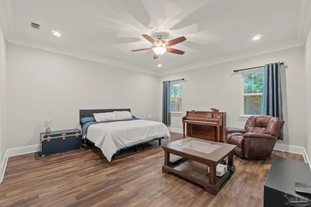 a bedroom with furniture and a window