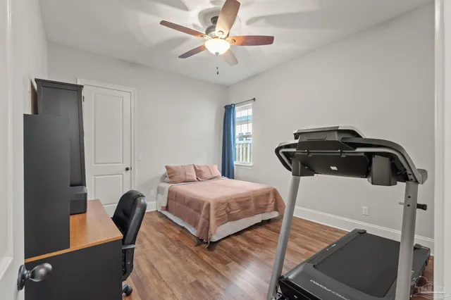 a bedroom with furniture and a air conditioner vent