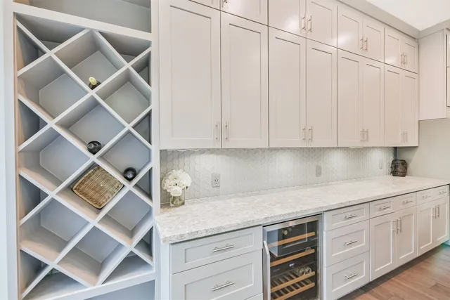 a kitchen with a cabinets and white appliances