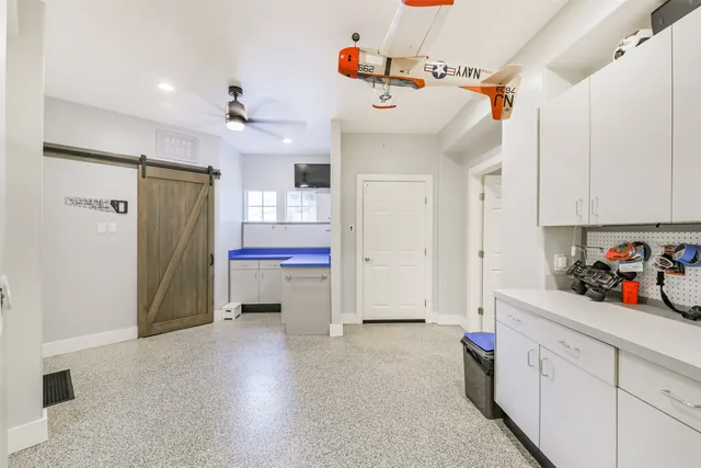 a view of a storage & utility room with closet