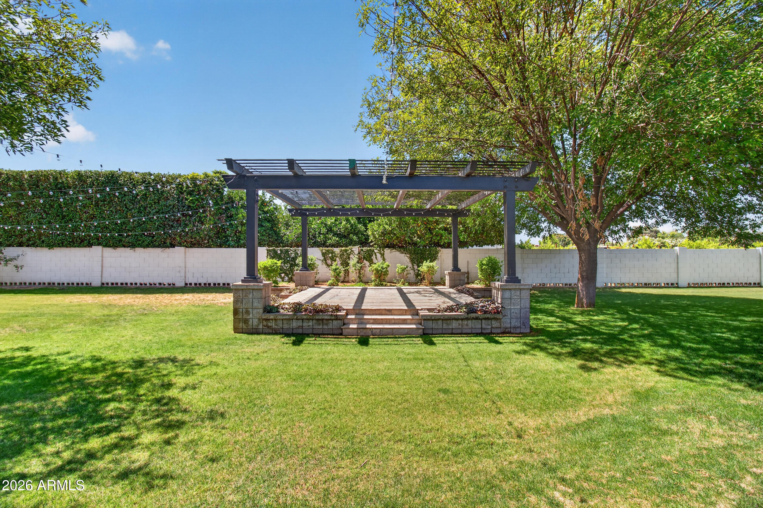2677 East Queen Creek Road Gilbert, AZ 85297 - Photo 106 of 128 a view of a swimming pool with a yard