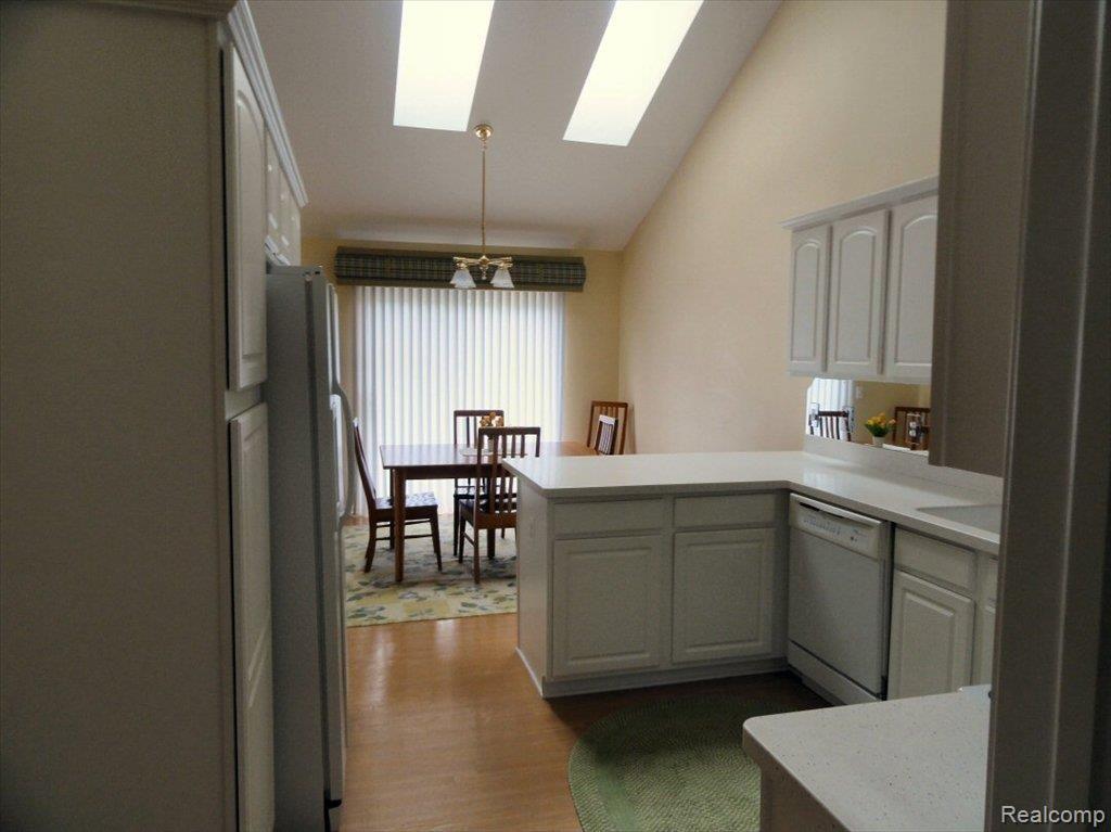 8112 Huntington Ridge Court, Unit 5 Washington, MI 48094 - Photo 13 of 24 KITCHEN FROM LAUNDRY
