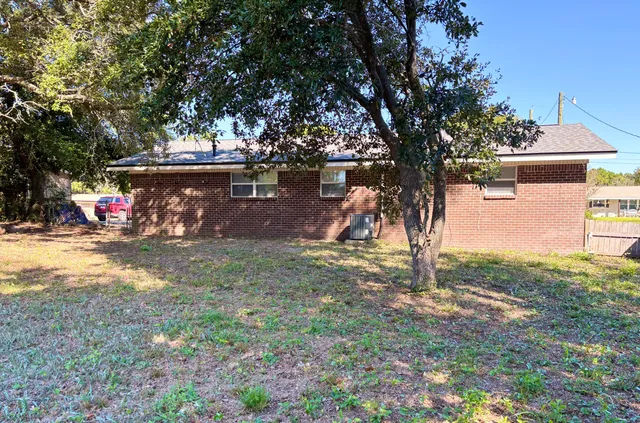 a view of a park with large trees