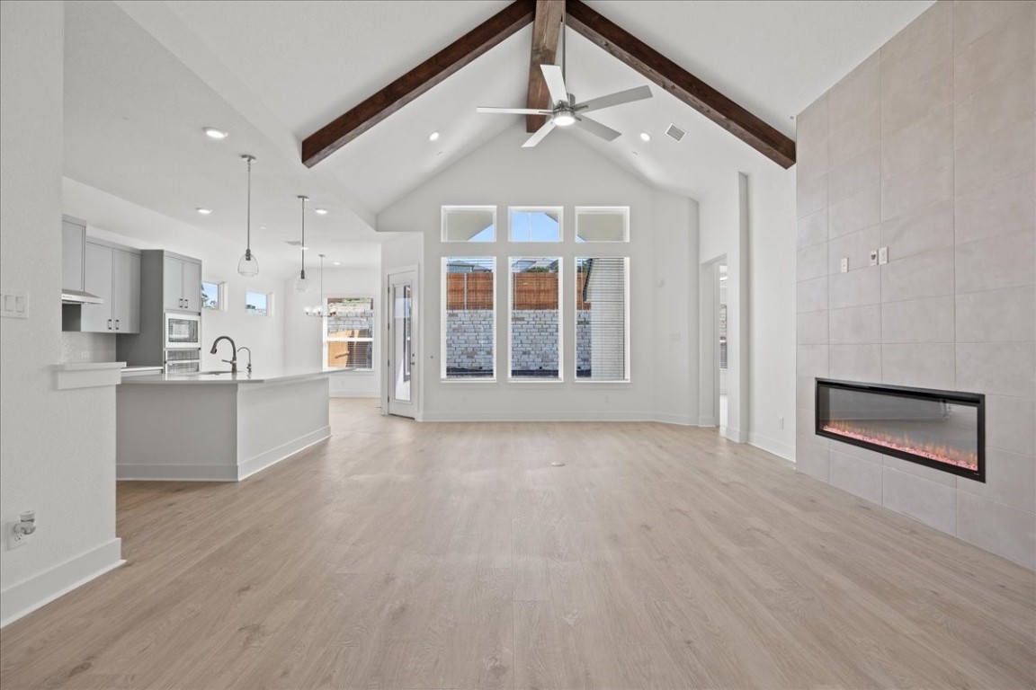 18809 Hopper Lane Austin, TX 78738 - Photo 1 of 1 a view of an empty room with kitchen and window