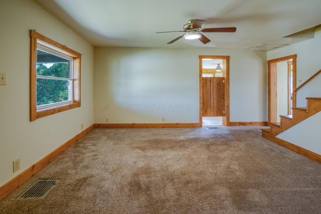 681 Downing Road Stockport, OH 43787 - Photo 26 of 36 living room window and staircase view