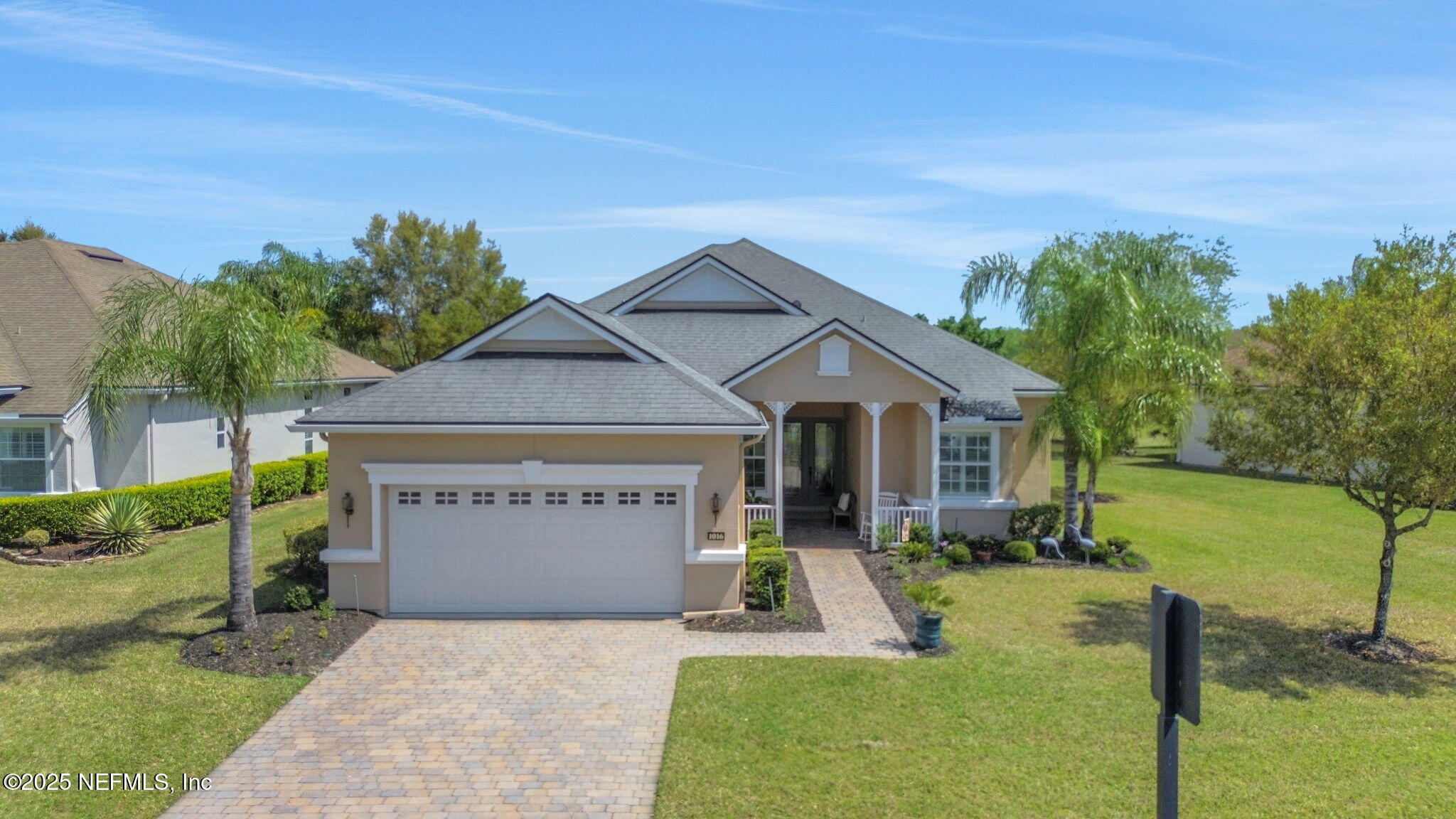 a front view of a house with garden