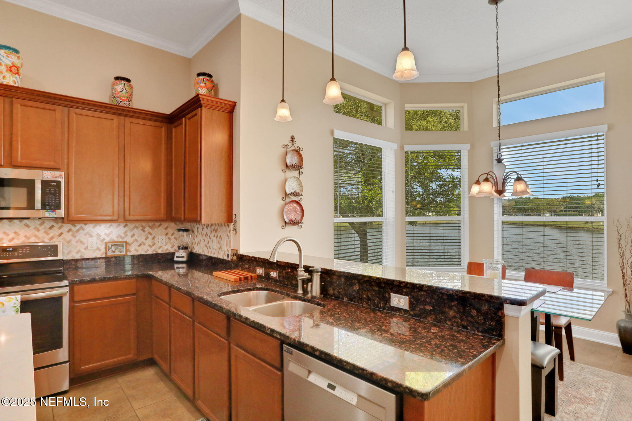 1016 Inverness Drive St. Augustine, FL 32092 - Photo 12 of 59 a kitchen with a sink stove and window
