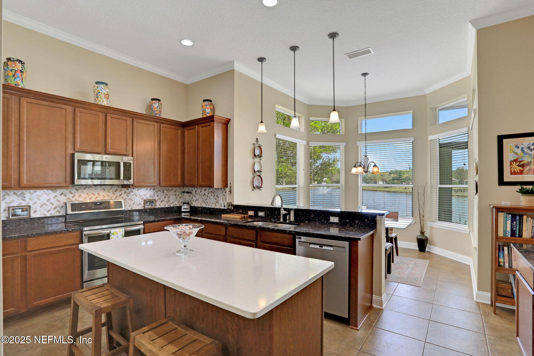 1016 Inverness Drive St. Augustine, FL 32092 - Photo 14 of 59 a kitchen with a sink stove and cabinets