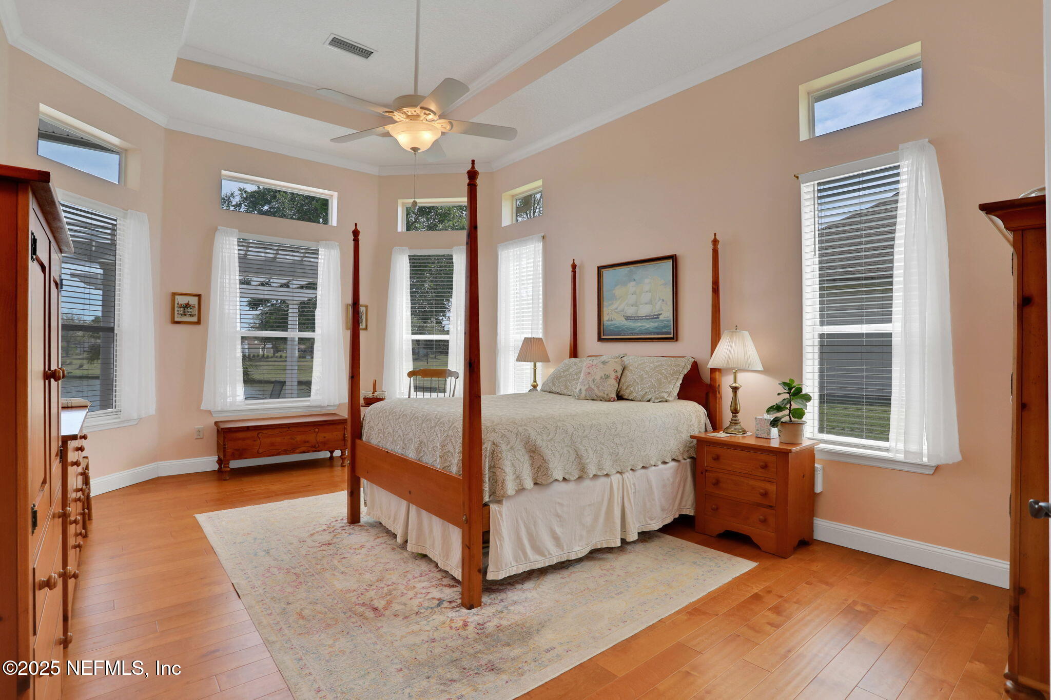 1016 Inverness Drive St. Augustine, FL 32092 - Photo 18 of 59 a living room with a bed furniture and two window