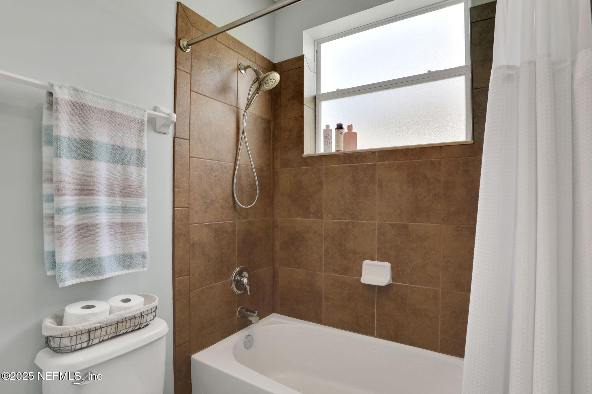 1016 Inverness Drive St. Augustine, FL 32092 - Photo 28 of 59 a bathroom with a sink and a shower