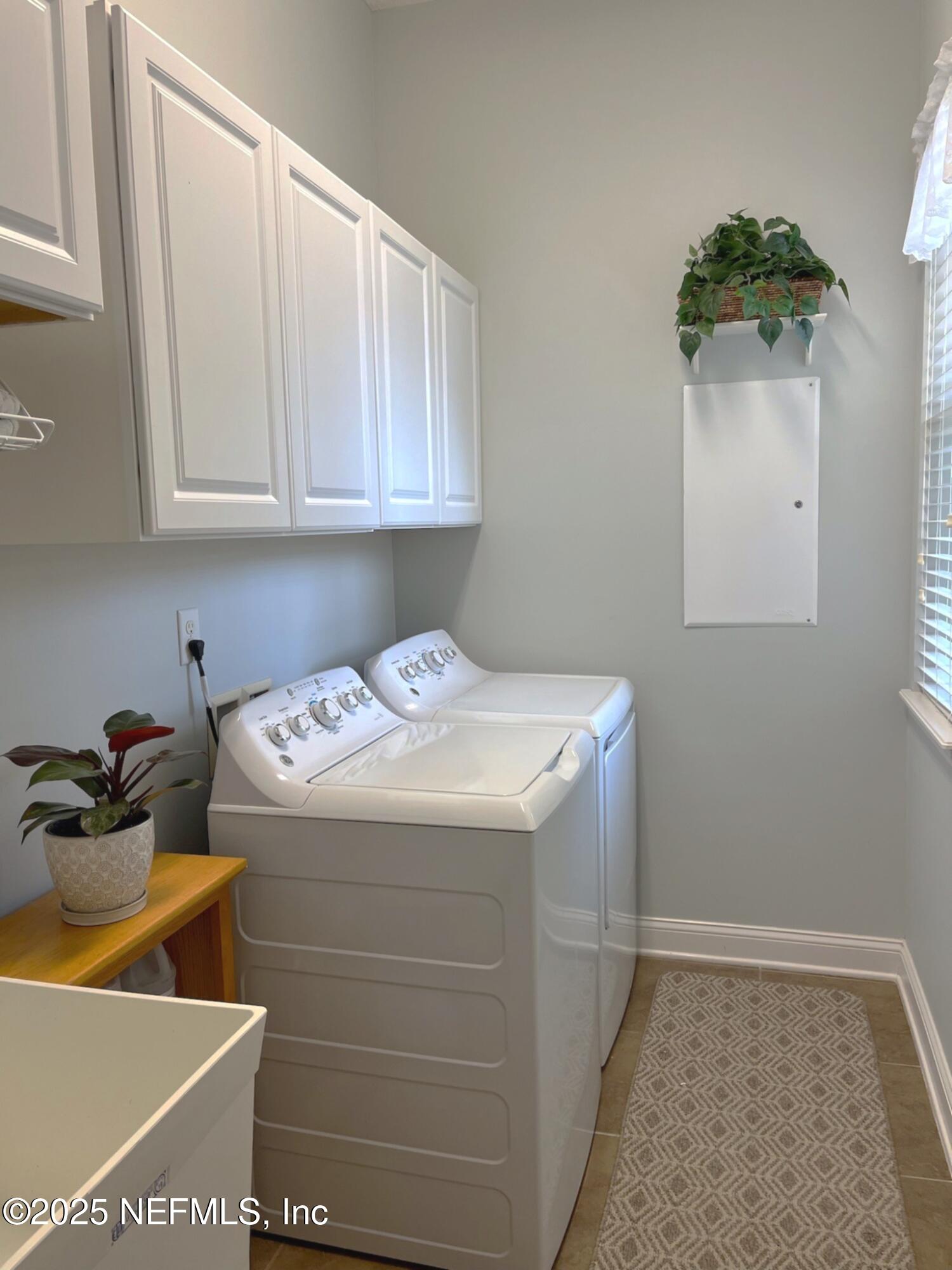 1016 Inverness Drive St. Augustine, FL 32092 - Photo 31 of 59 a utility room with dryer and washer