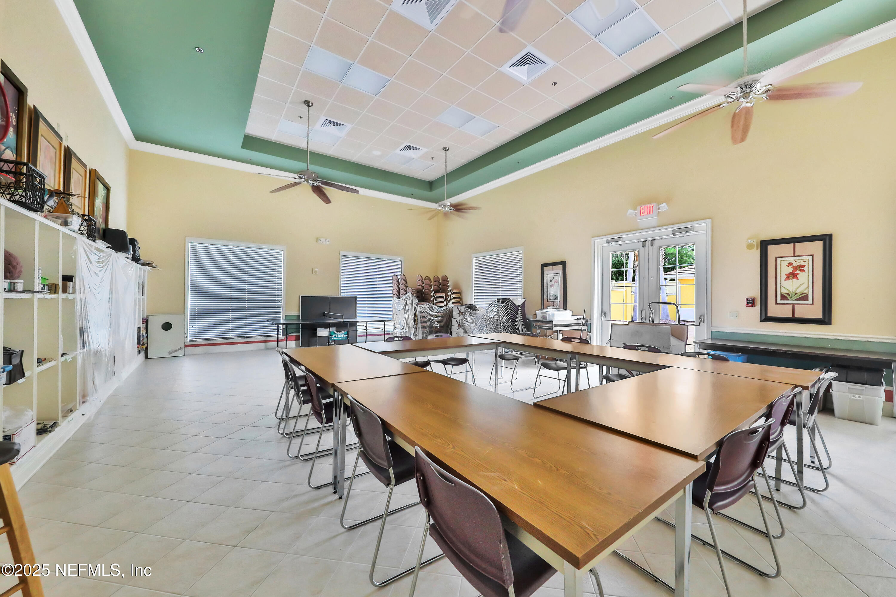 1016 Inverness Drive St. Augustine, FL 32092 - Photo 47 of 59 a dining hall with stainless steel appliances granite countertop a stove a sink a dining table and chairs with the wooden floor