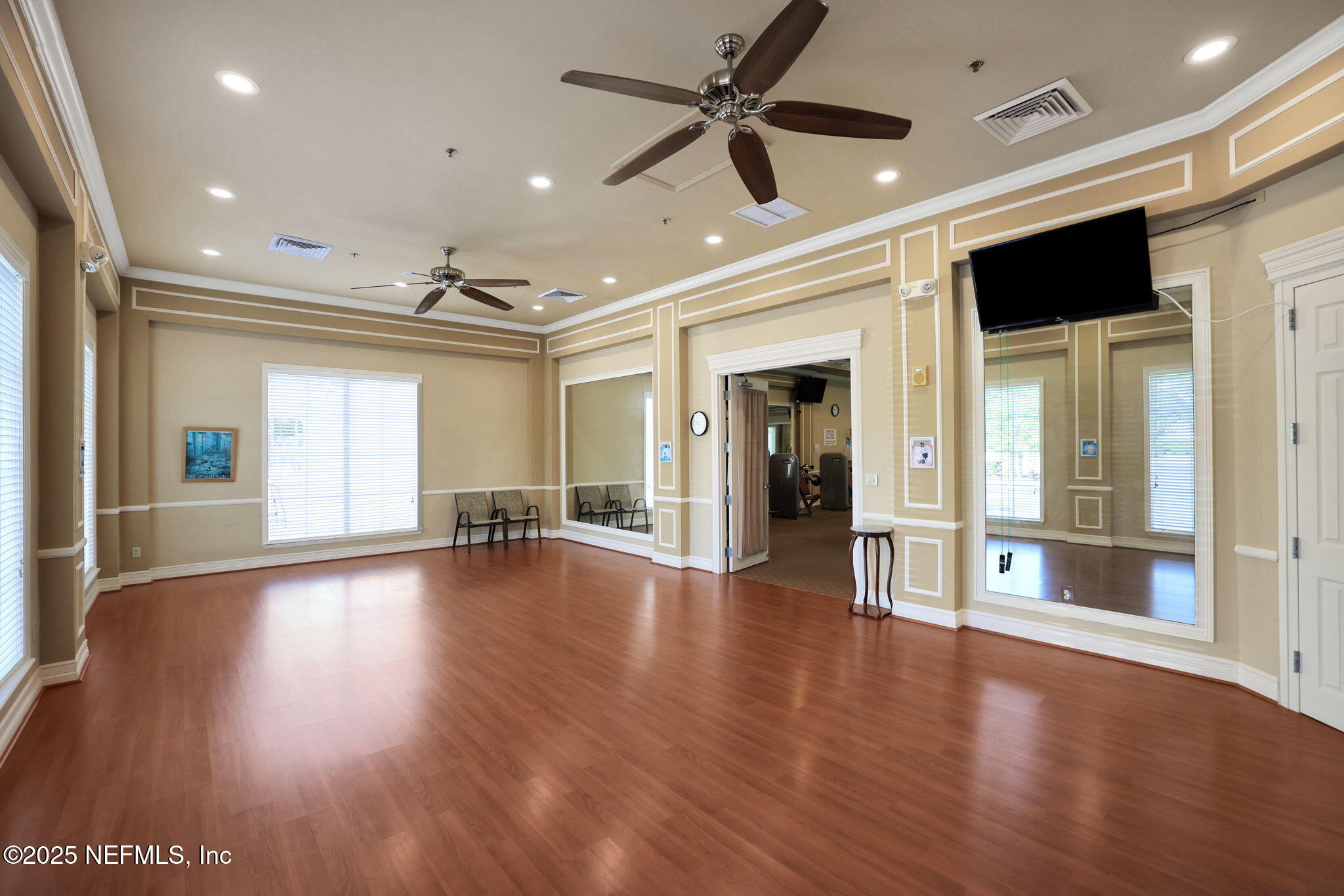 1016 Inverness Drive St. Augustine, FL 32092 - Photo 49 of 59 a view of an empty room with wooden floor and a window