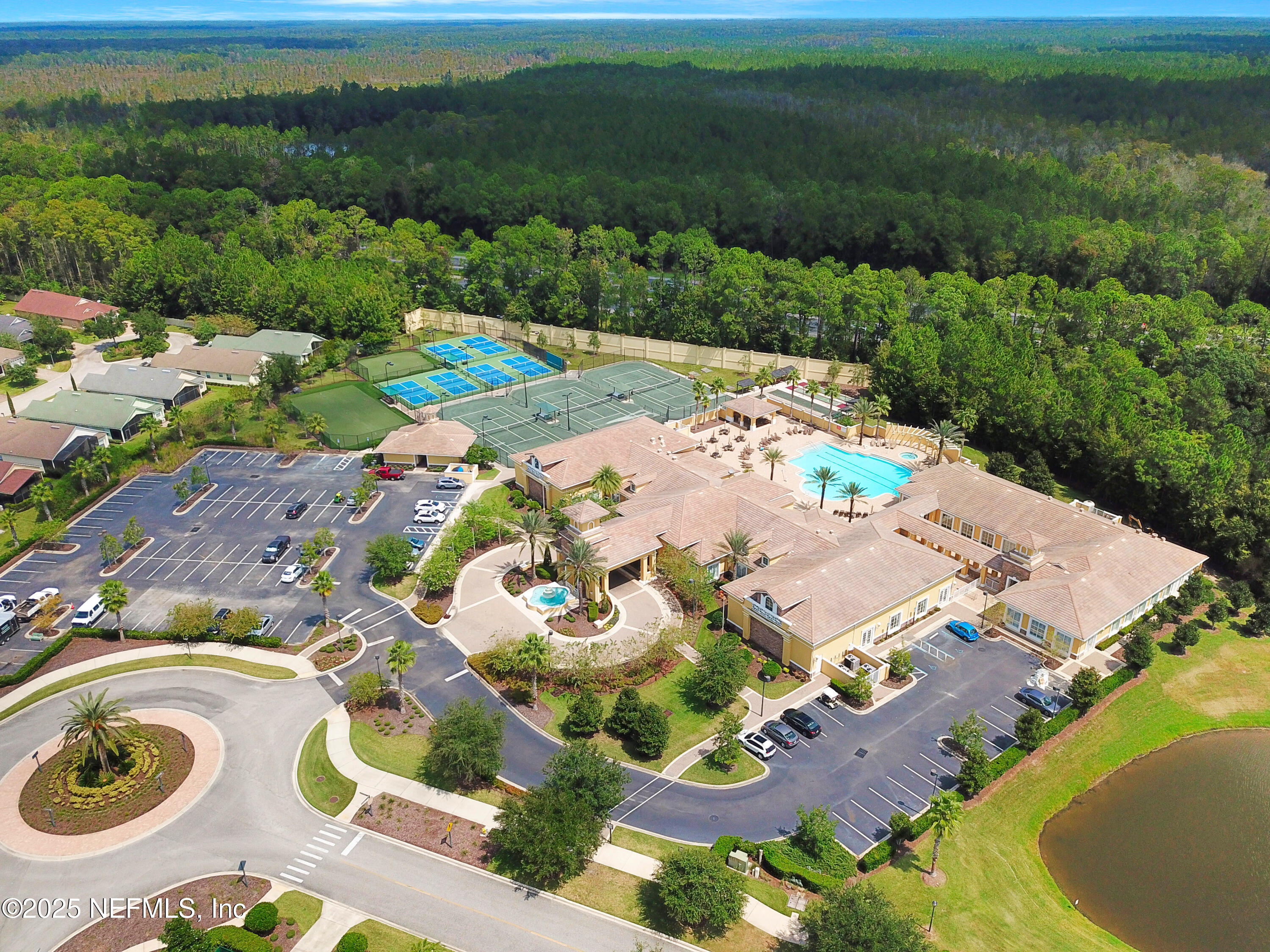 1016 Inverness Drive St. Augustine, FL 32092 - Photo 51 of 59 an aerial view of a house with swimming pool and lake view