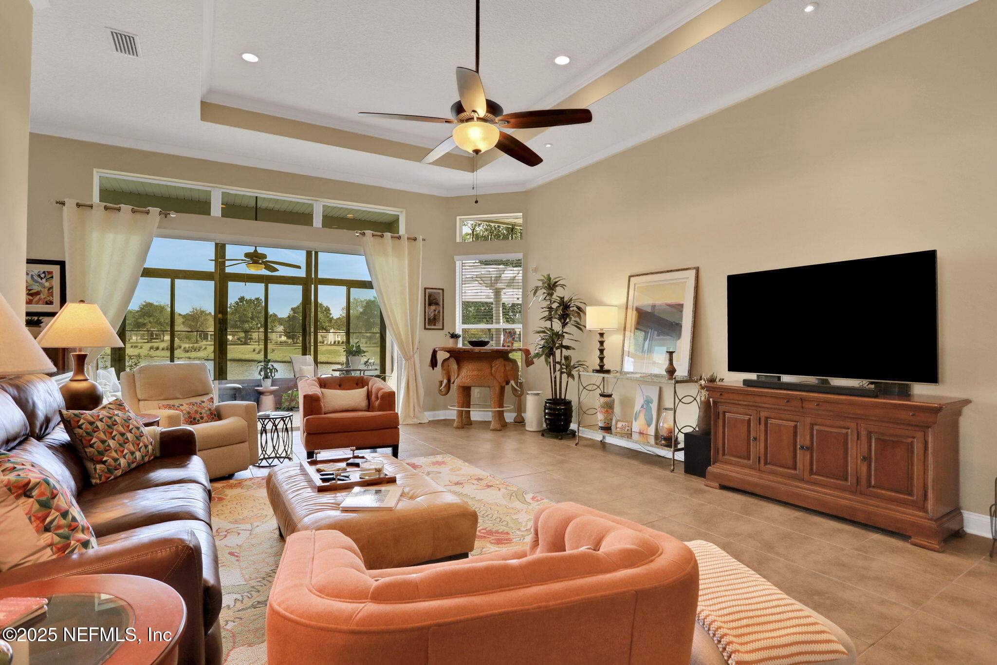1016 Inverness Drive St. Augustine, FL 32092 - Photo 8 of 59 a living room with furniture and a flat screen tv