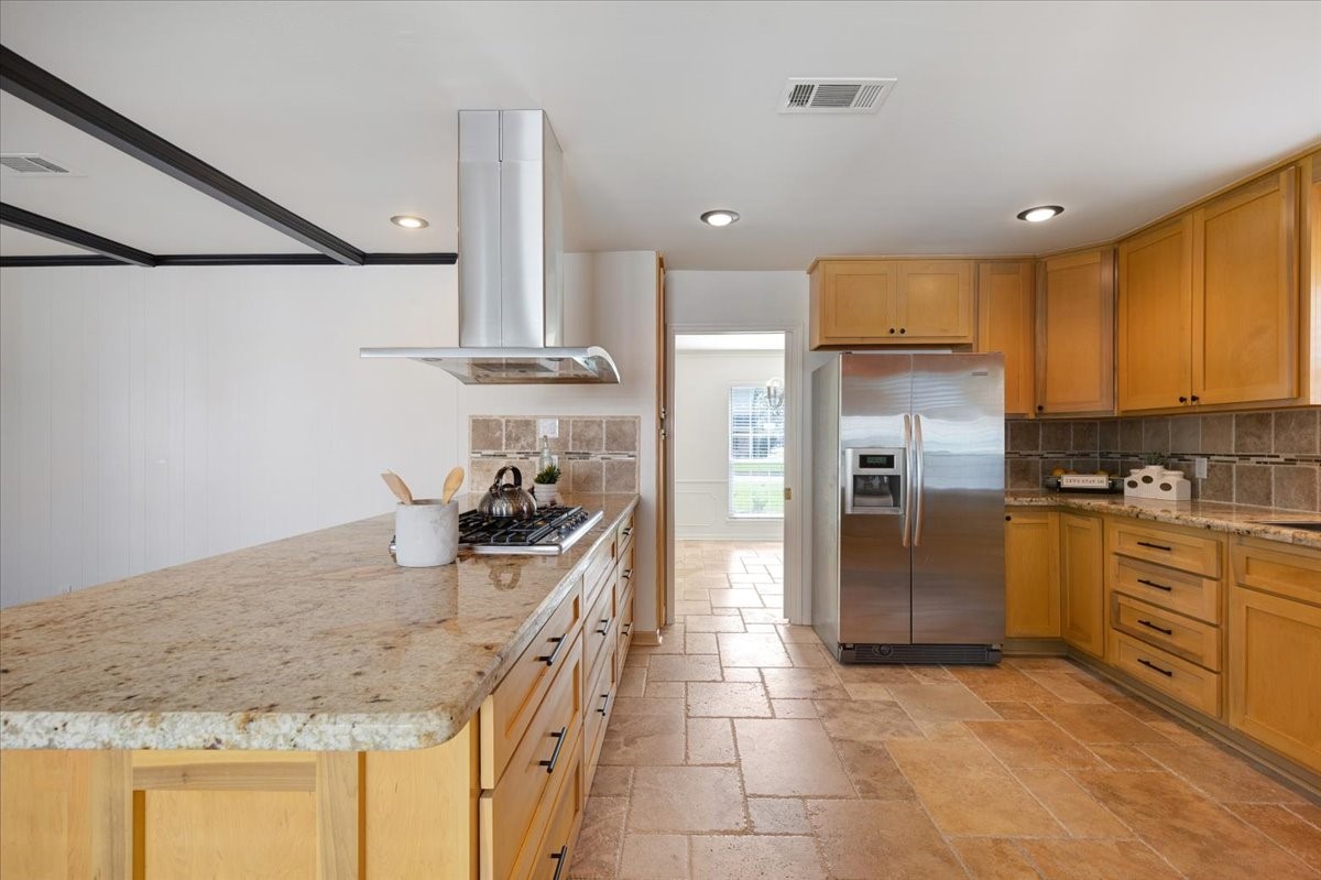 2103 Southwick Street Houston, TX 77080 - Photo 15 of 49 a kitchen with stainless steel appliances granite countertop a sink stove and refrigerator