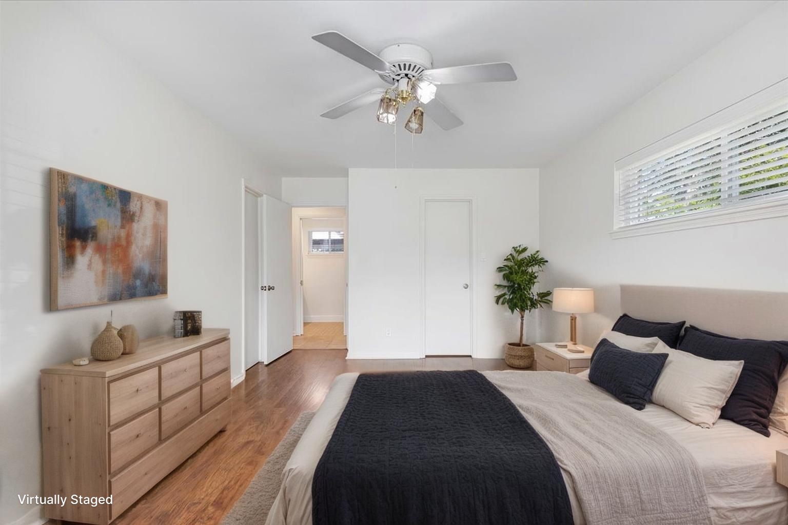 2103 Southwick Street Houston, TX 77080 - Photo 18 of 49 a bedroom with bed and a chandelier