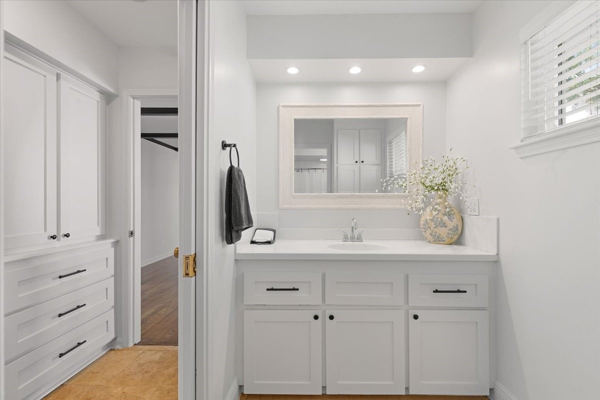2103 Southwick Street Houston, TX 77080 - Photo 20 of 49 a bathroom with a sink and a mirror