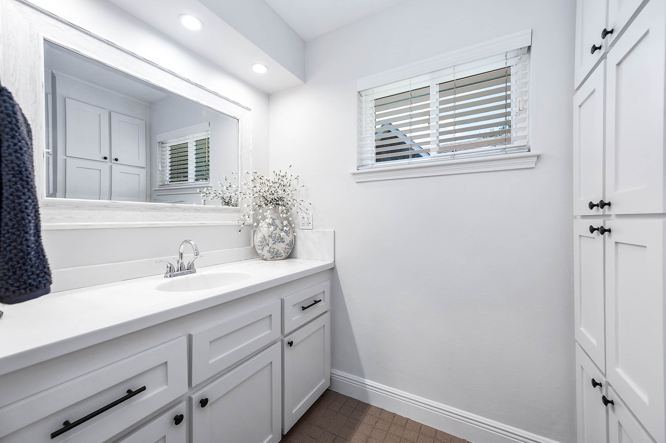 2103 Southwick Street Houston, TX 77080 - Photo 21 of 49 a bathroom with a sink a mirror and a shower