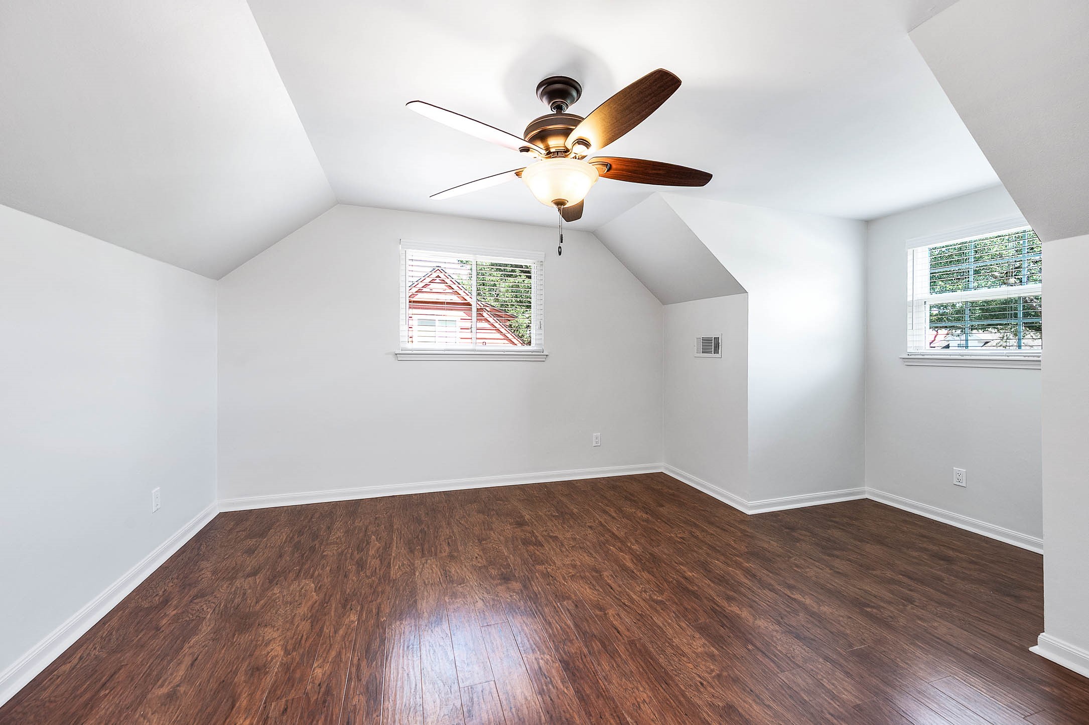 2103 Southwick Street Houston, TX 77080 - Photo 24 of 49 a view of a big room with wooden floor and windows