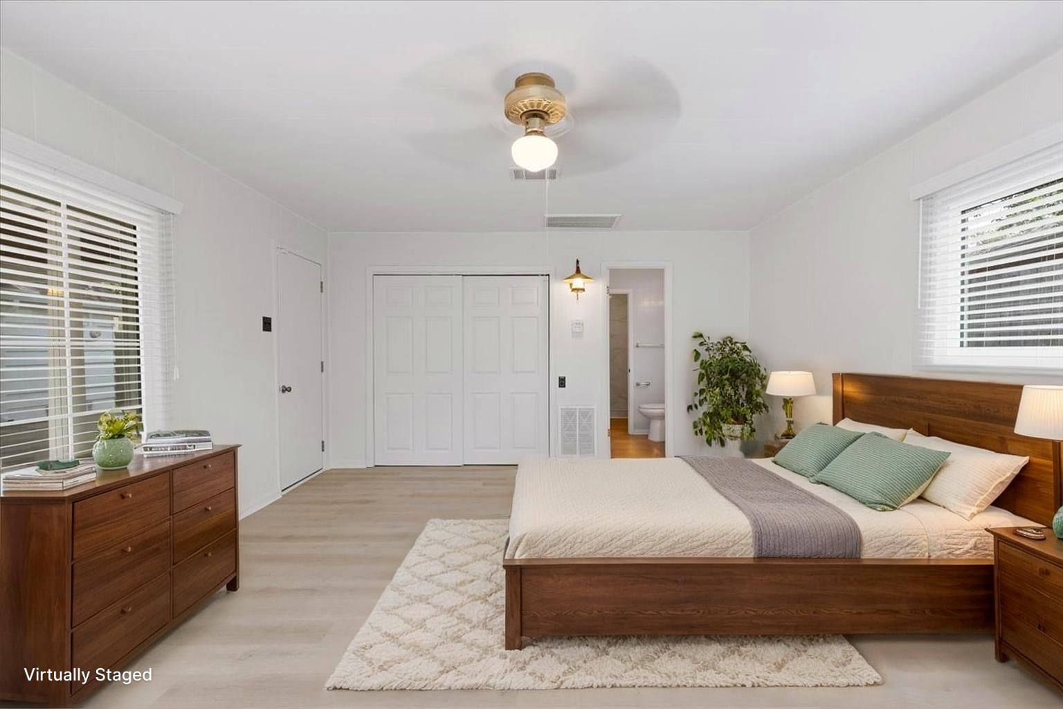 2103 Southwick Street Houston, TX 77080 - Photo 32 of 49 a bedroom with a large bed and a chandelier