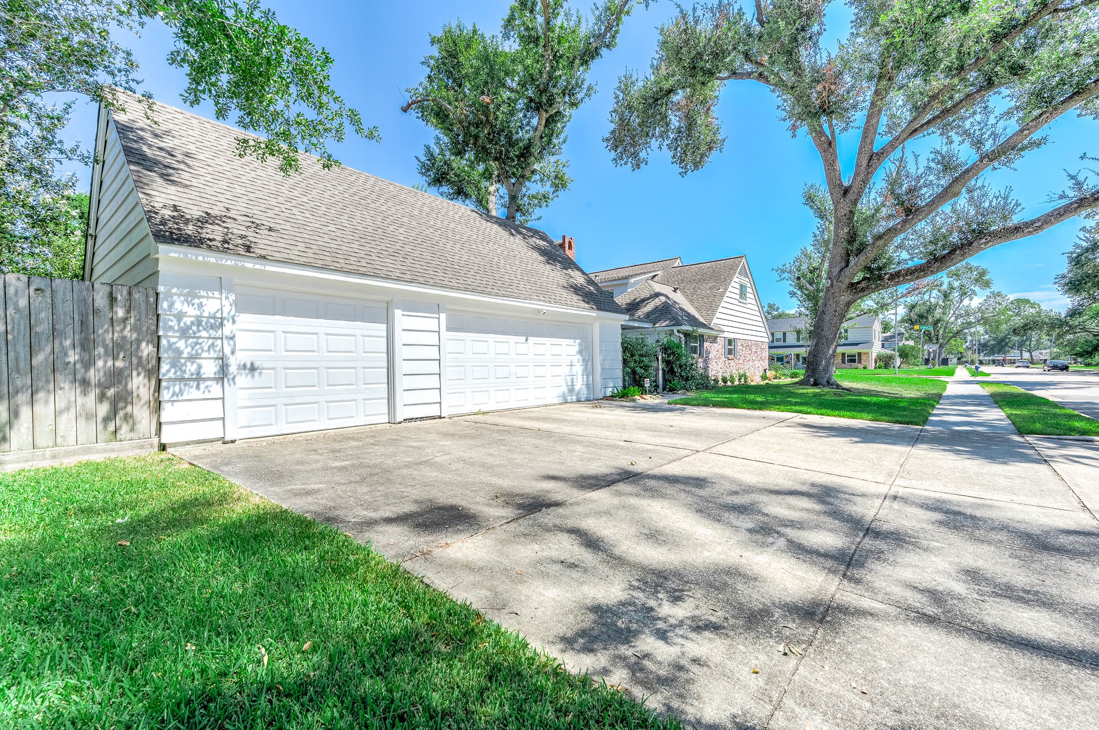 2103 Southwick Street Houston, TX 77080 - Photo 46 of 49 a view of a backyard with large trees