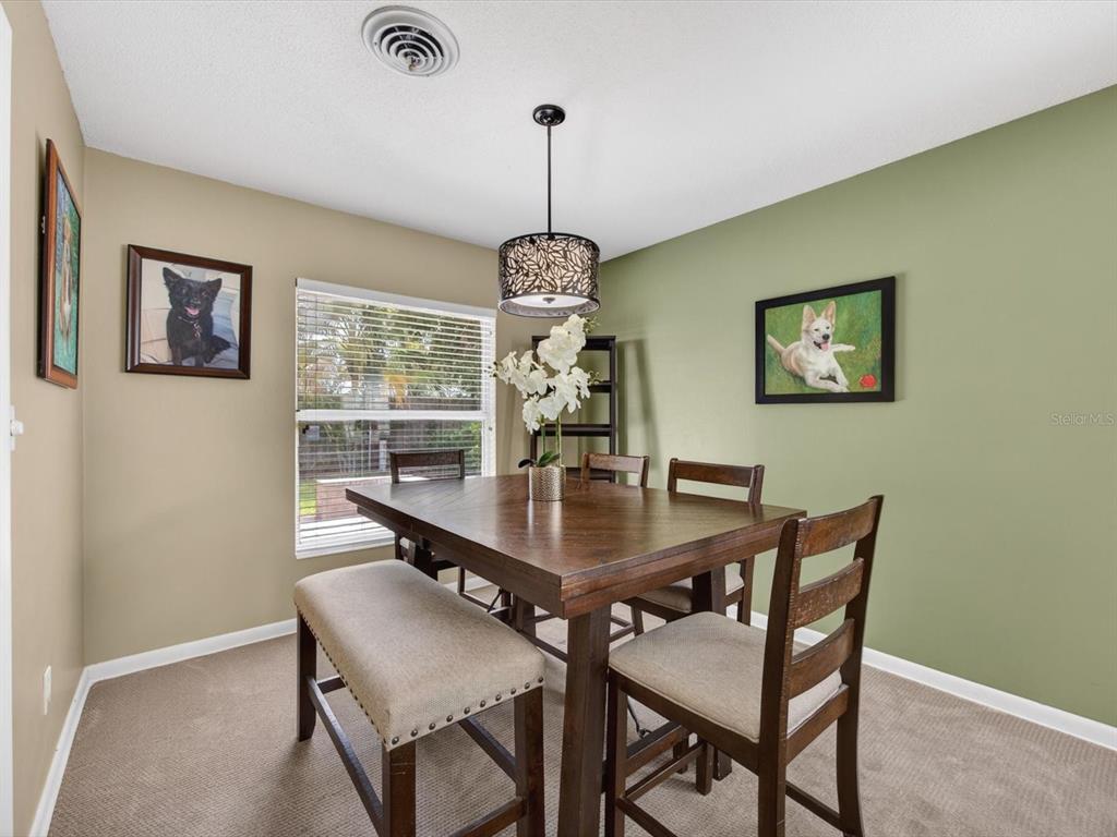 2803 Banchory Road Winter Park, FL 32792 - Photo 12 of 31 a dining room with furniture and window