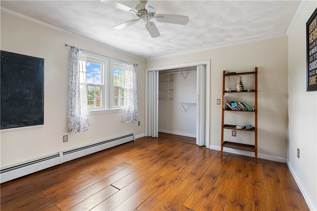 5 Victoria Lane Rehoboth, MA 02769 - Photo 32 of 48 3rd bedroom with wood plank flooring.