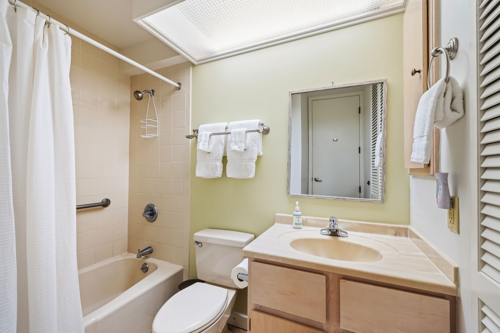 3811 Edward Road, Unit 1206 Princeville, HI 96722 - Photo 11 of 30 a bathroom with a sink toilet tub and shower