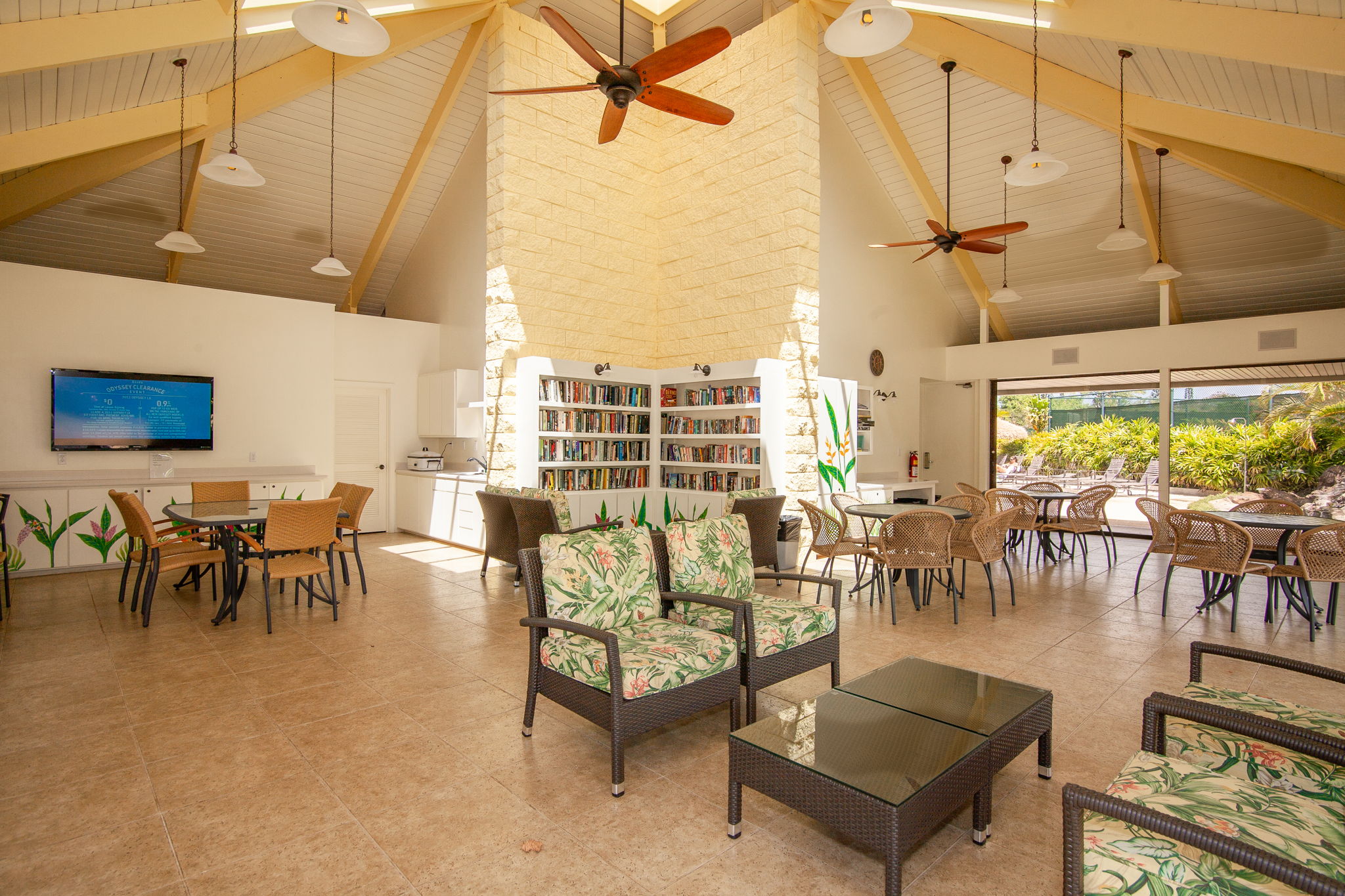 3811 Edward Road, Unit 1206 Princeville, HI 96722 - Photo 24 of 30 a living room with lots of furniture and a painting on the wall