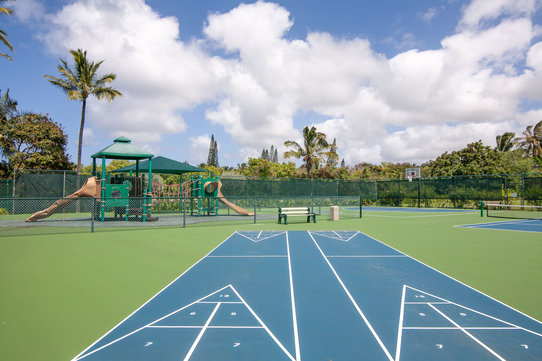 3811 Edward Road, Unit 1206 Princeville, HI 96722 - Photo 26 of 30 a view of an outdoor space and tennis court