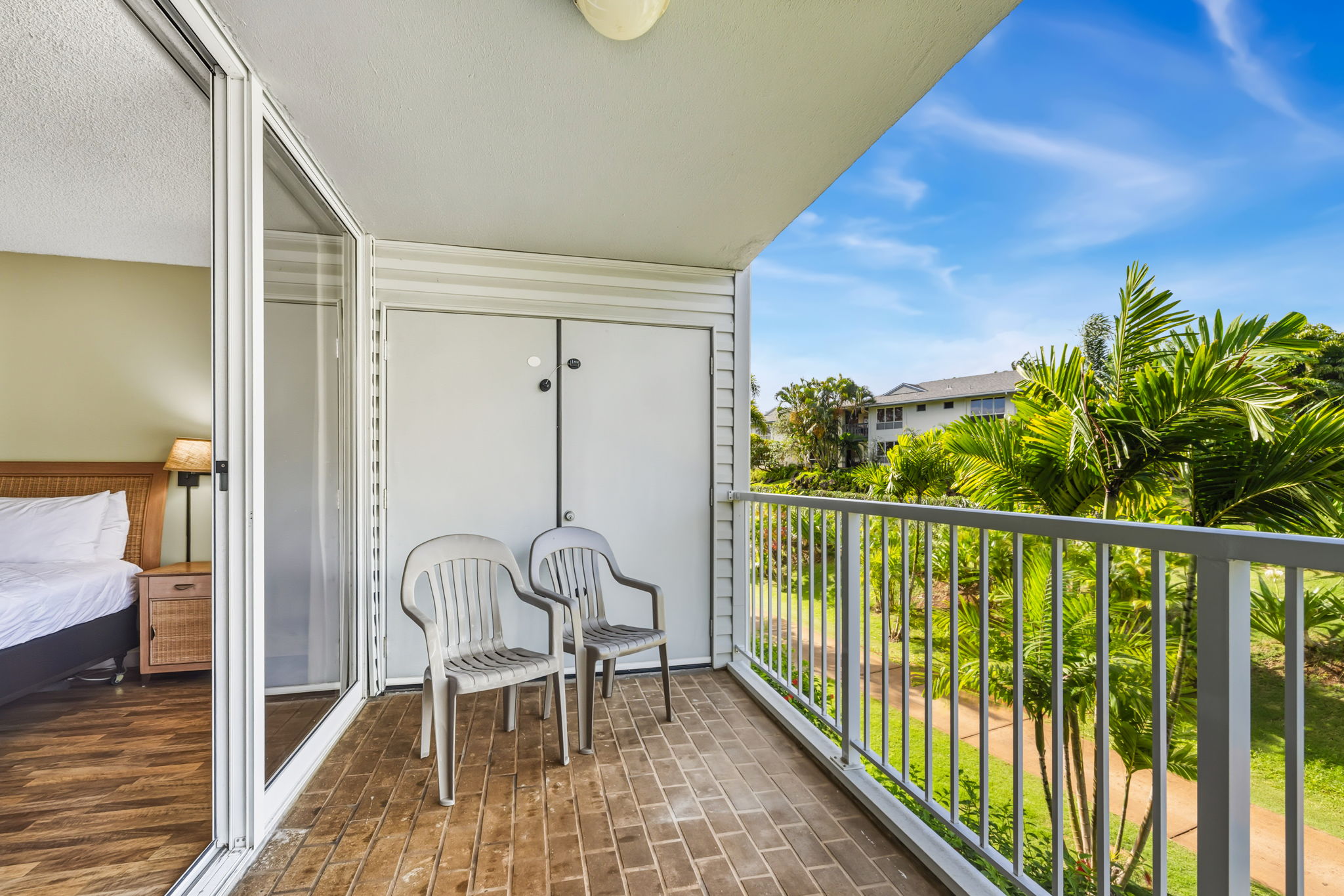 3811 Edward Road, Unit 1206 Princeville, HI 96722 - Photo 8 of 30 a view of a balcony with chairs