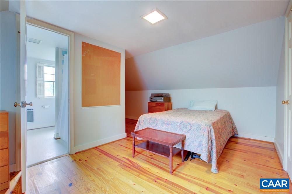 2808 Northfield Road Charlottesville, VA 22901 - Photo 20 of 30 a bedroom with a bed and wooden floor