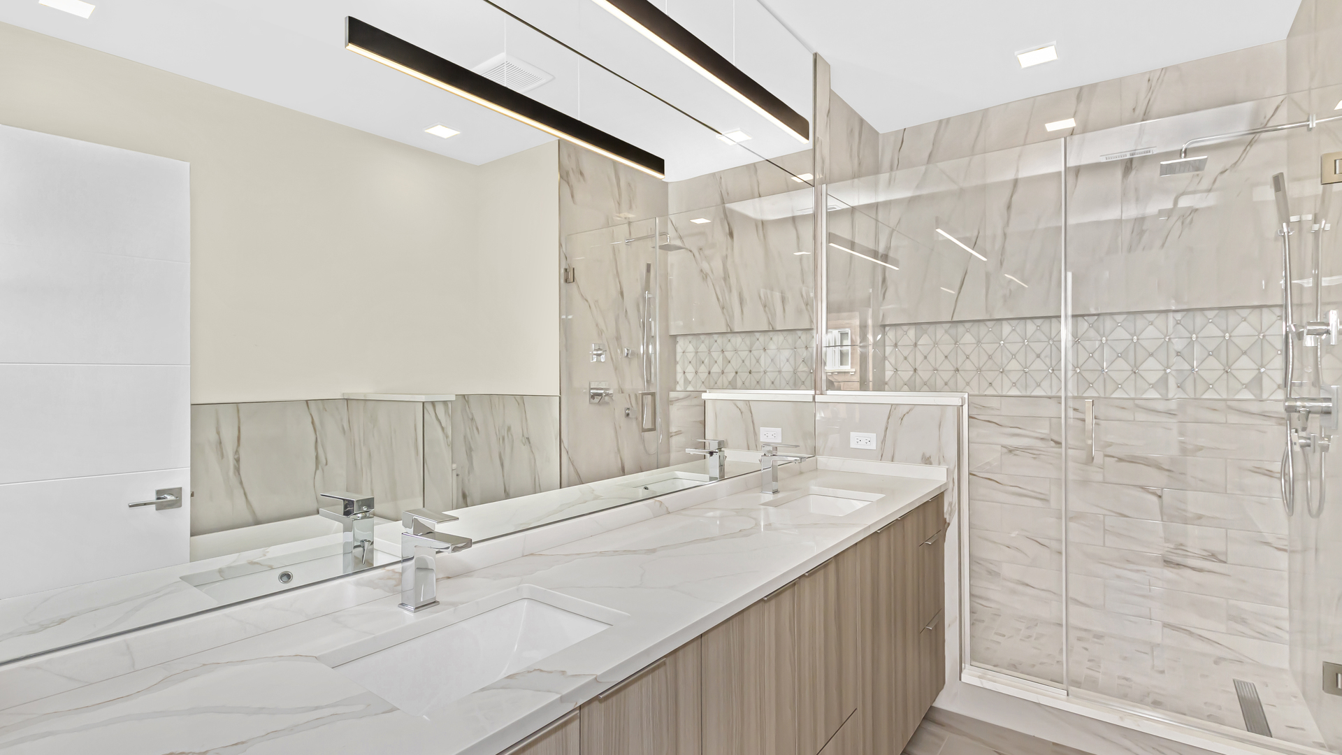 338 East Pershing Road Chicago, IL 60653 - Photo 16 of 44 a bathroom with a double vanity sink and a shower