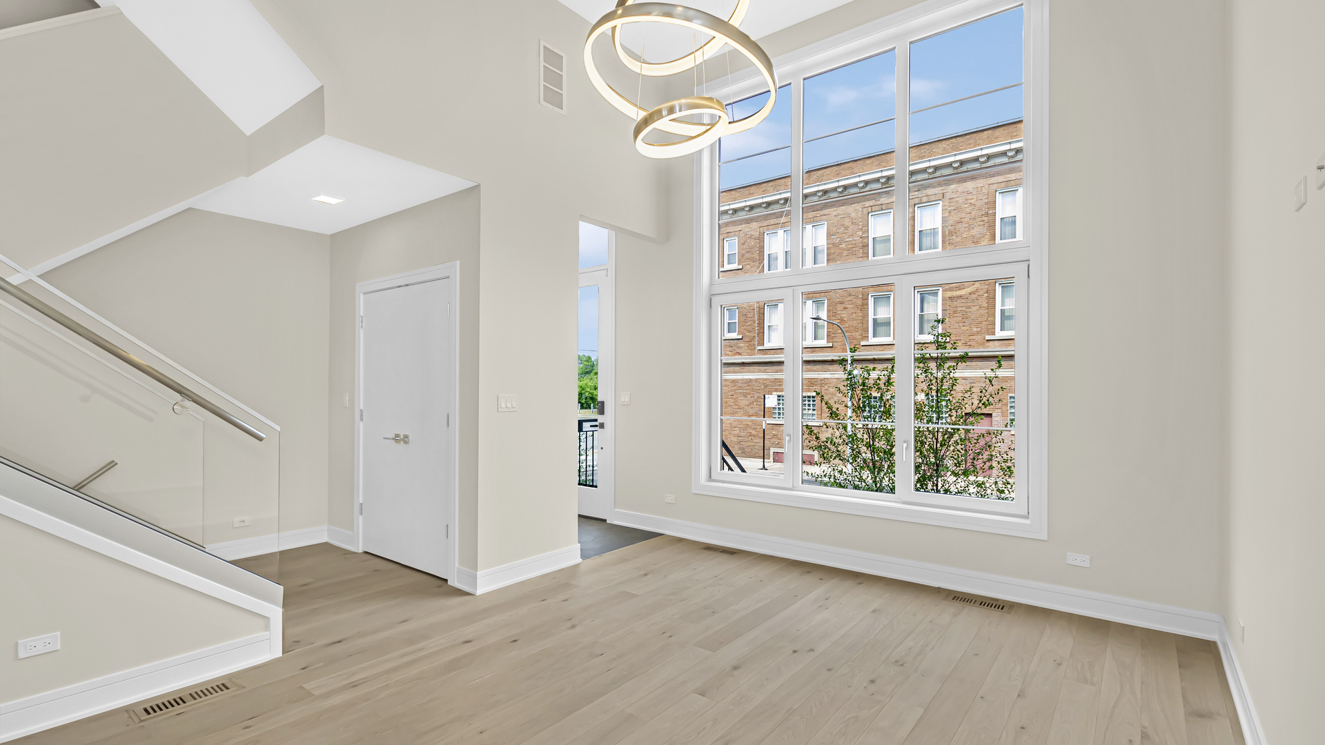 338 East Pershing Road Chicago, IL 60653 - Photo 3 of 44 wooden floor in an empty room with a window