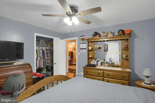 a bedroom with bed and tv