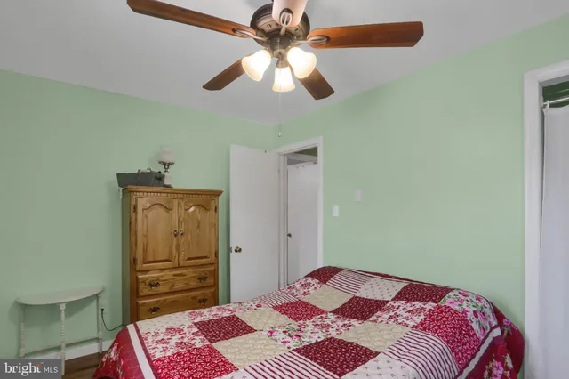 a bedroom with a bed and a dresser