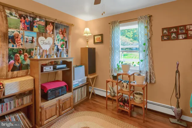 a bedroom with furniture and a window