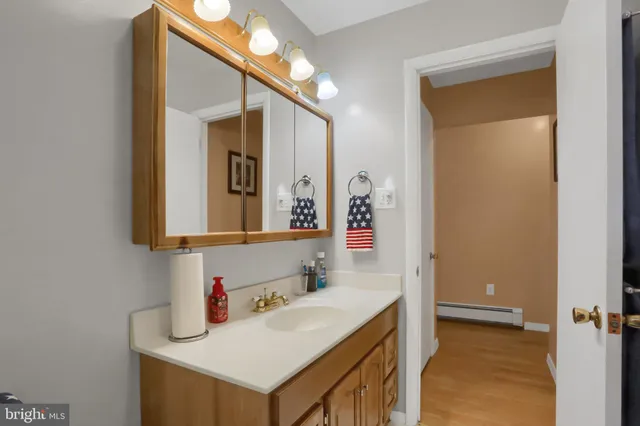 a bathroom with a sink and a mirror