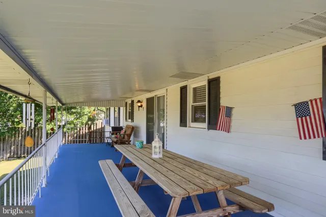 a view of a patio with wooden floor