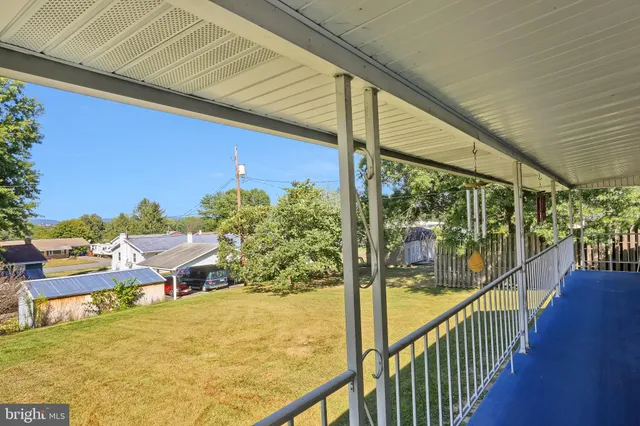 a view of a balcony with chairs