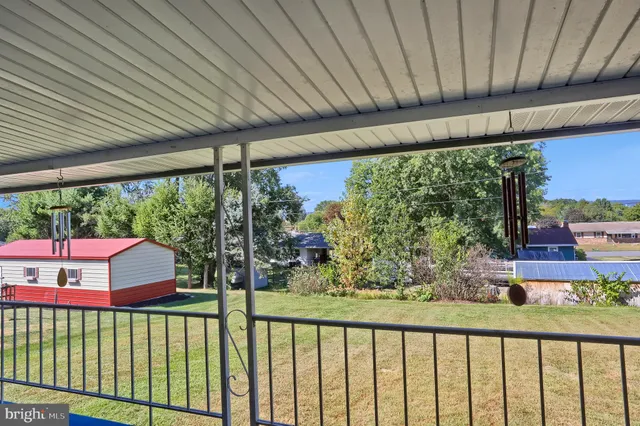 a view of a porch and garden