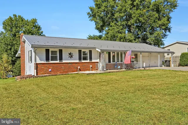 front view of a house with a yard