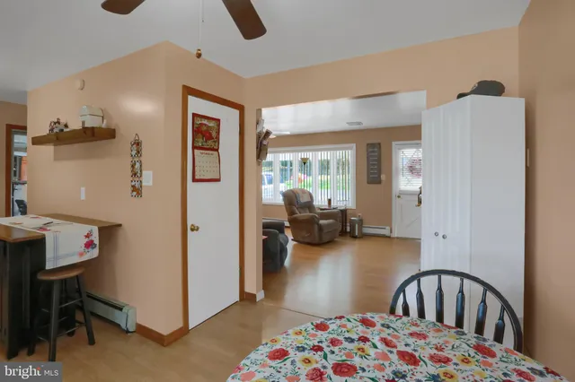 a bedroom with furniture and a large window