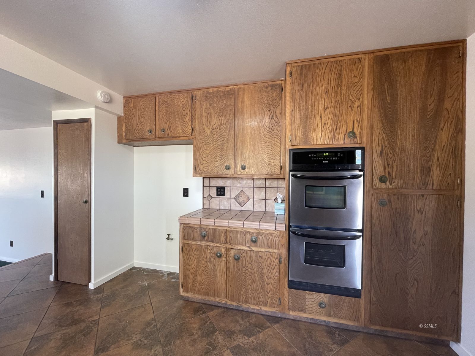 1562 West Reeves Avenue Ridgecrest, CA 93555 - Photo 7 of 45 a kitchen with a stove microwave and sink