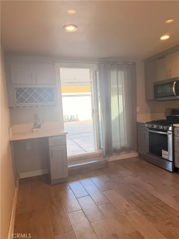 a view of a kitchen with microwave and stove