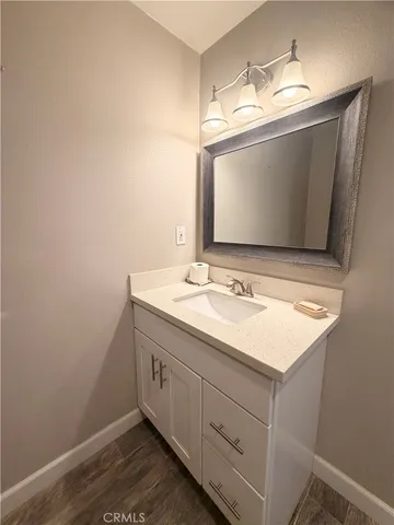 a bathroom with a sink and mirror