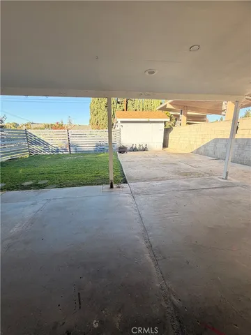 a view of a big yard with an outdoor seating